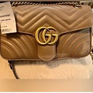 Tan Gucci bag still has tags on it never used